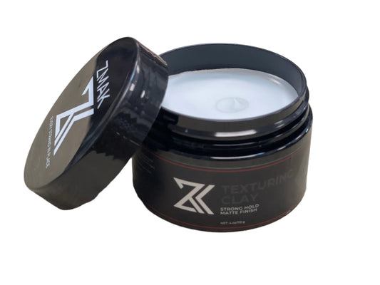 ZMAK Hair Texturing Clay delivers strong hold, zero shine, and flake-free matte texture. Ideal for modern styles. Made in USA.