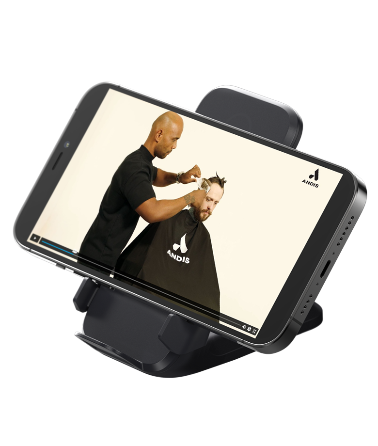 Andis beSPOKE 74140 wireless induction charging pad holding a phone