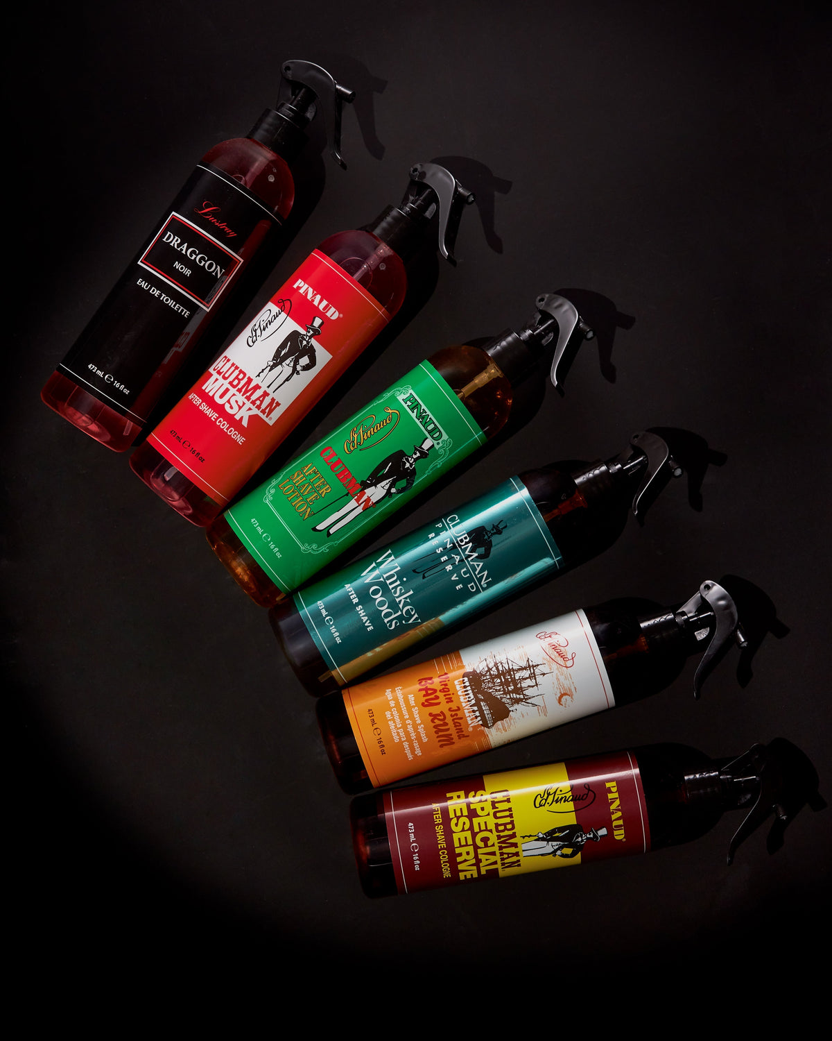 Clubman Special Reserve 16 oz barber spray in a diagonal Clubman product arrangement