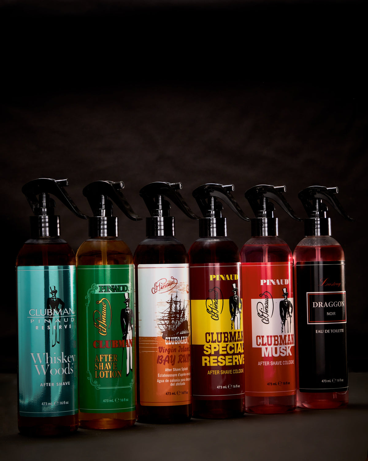 Clubman Special Reserve 16 oz barber spray shown in the full fragrance lineup