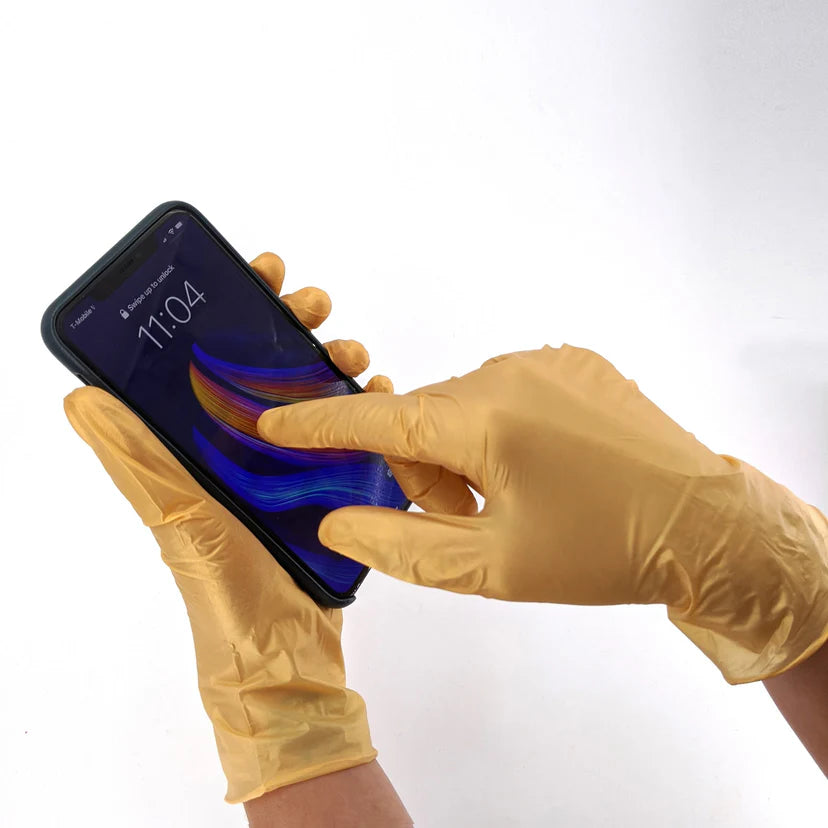 Colortrak Golden Glow nitrile gloves using a touchscreen phone