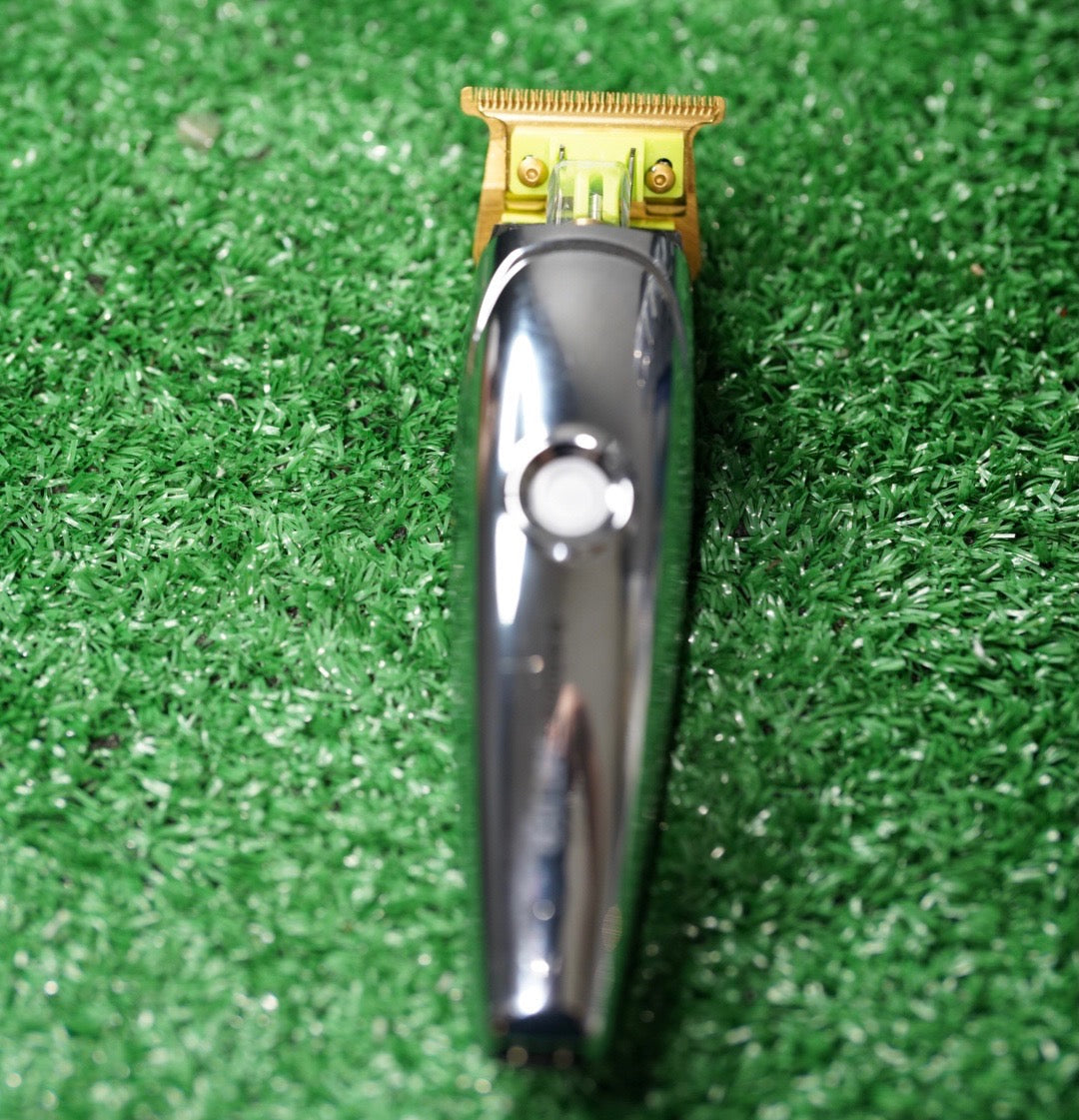Philthy Blendz Gamma Hitter/Rebel 2.0 to Andis GTX Cam – modified silver trimmer front view on green turf
